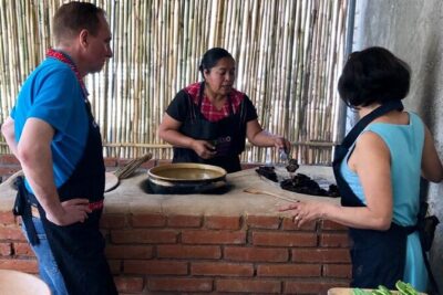 Traditional Cooking Class with Minerva Lopez - The outdoor kitchen setup: garden cooking and hot, real stoves
